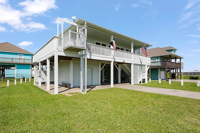 981 S S Gtwy, Crystal Beach, TX 77650 - rear view of property featuring concrete driveway, a lawn, a carport, and stairway