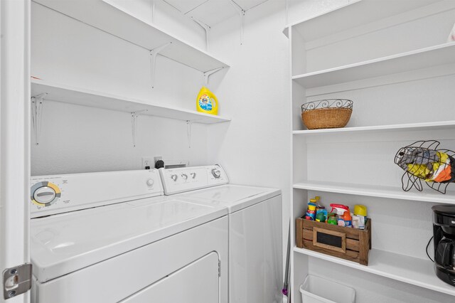 981 S S Gtwy, Crystal Beach, TX 77650 - laundry area featuring washing machine and clothes dryer