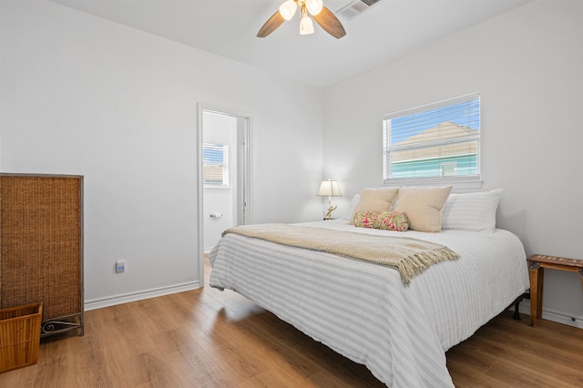 981 S S Gtwy, Crystal Beach, TX 77650 - bedroom featuring wood finished floors, baseboards, and ceiling fan