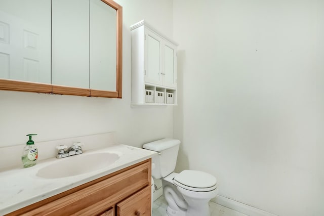bathroom featuring toilet and vanity