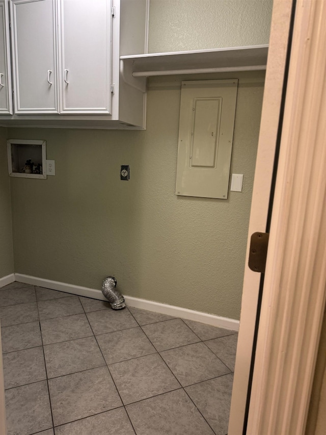 laundry area with baseboards, electric panel, electric dryer hookup, washer hookup, and tile patterned floors