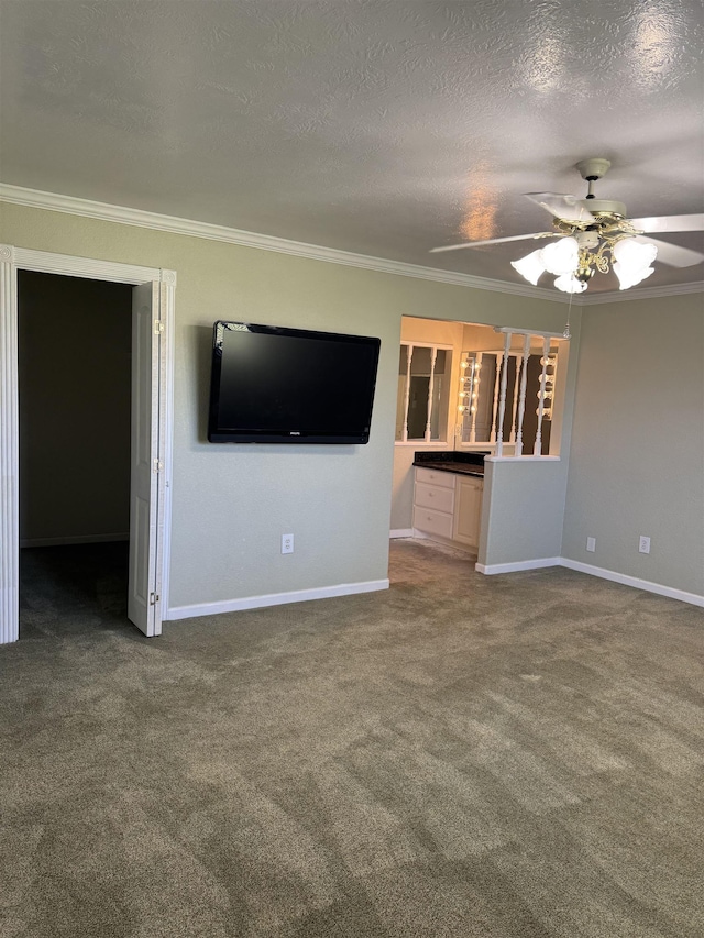 unfurnished living room with a ceiling fan, a textured ceiling, carpet flooring, crown molding, and baseboards