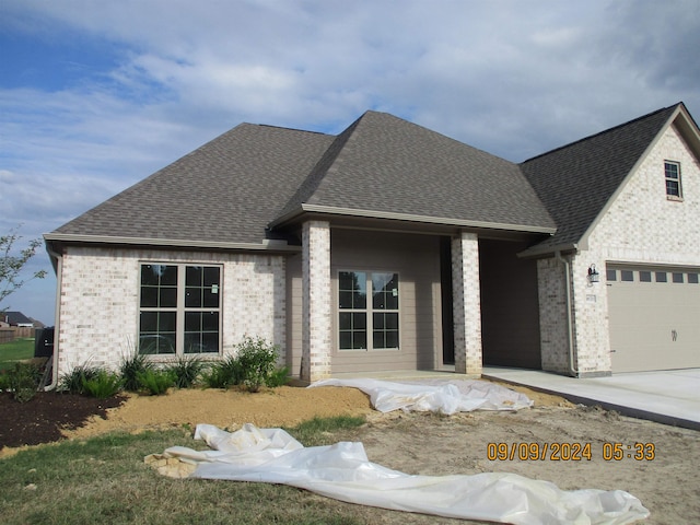 view of front of property with a garage