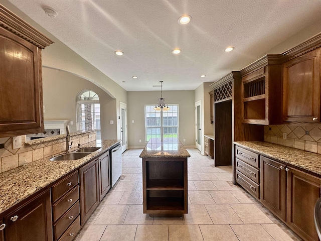 305 Tyler Dr, Bridge City, TX 77630 - kitchen with open shelves, a sink, backsplash, arched walkways, and recessed lighting