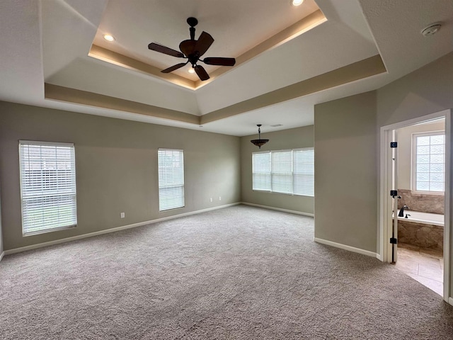 305 Tyler Dr, Bridge City, TX 77630 - carpeted spare room with a raised ceiling, baseboards, plenty of natural light, and recessed lighting