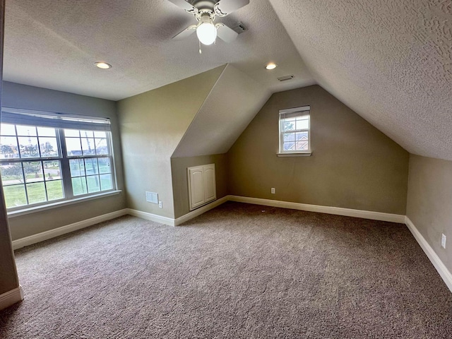 305 Tyler Dr, Bridge City, TX 77630 - additional living space with a textured ceiling, carpet flooring, baseboards, lofted ceiling, and a ceiling fan