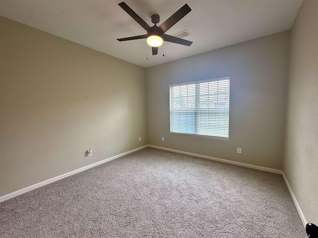 305 Tyler Dr, Bridge City, TX 77630 - spare room featuring a ceiling fan, carpet, and baseboards