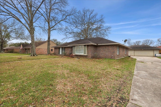 view of front of home with a front lawn, an outdoor structure, and brick siding