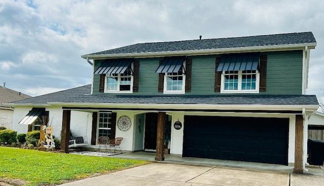 view of front of house featuring a garage, a porch, driveway, and a shingled roof