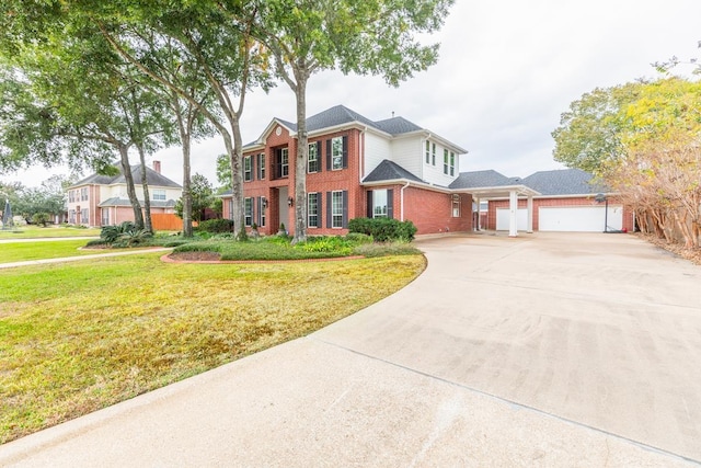 view of front of house with a front yard and a garage