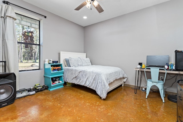 bedroom with ceiling fan and concrete flooring