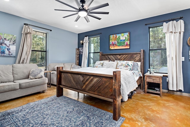 bedroom featuring multiple windows and ceiling fan