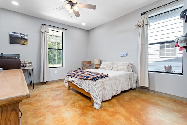 bedroom featuring concrete flooring and ceiling fan