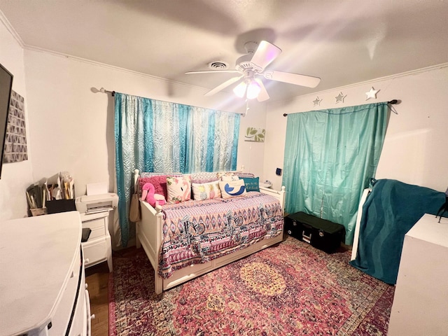 bedroom featuring ceiling fan and crown molding