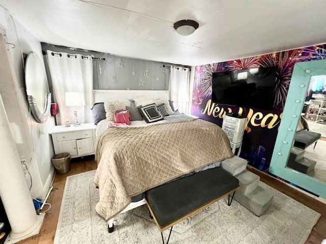 bedroom featuring wood-type flooring