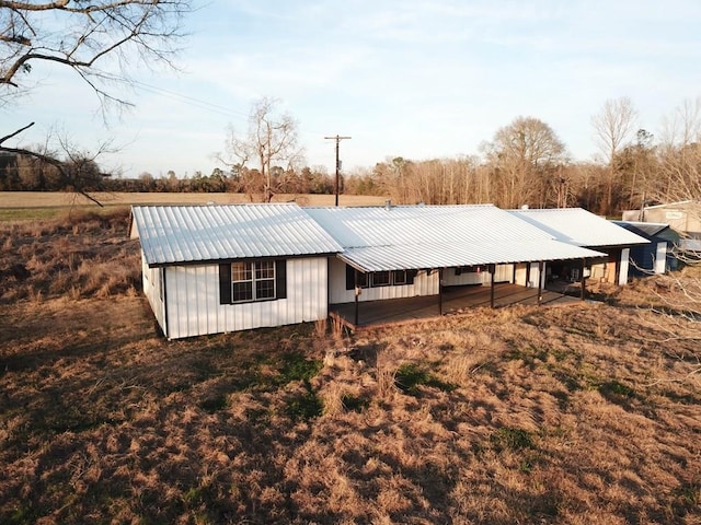 exterior space with metal roof