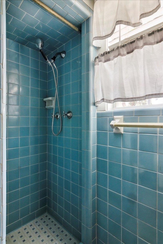 bathroom with a tile shower