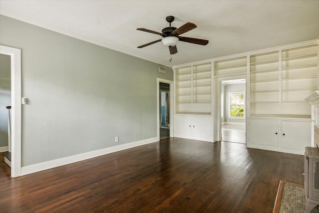 interior space with built in features, ceiling fan, dark wood-type flooring, and crown molding