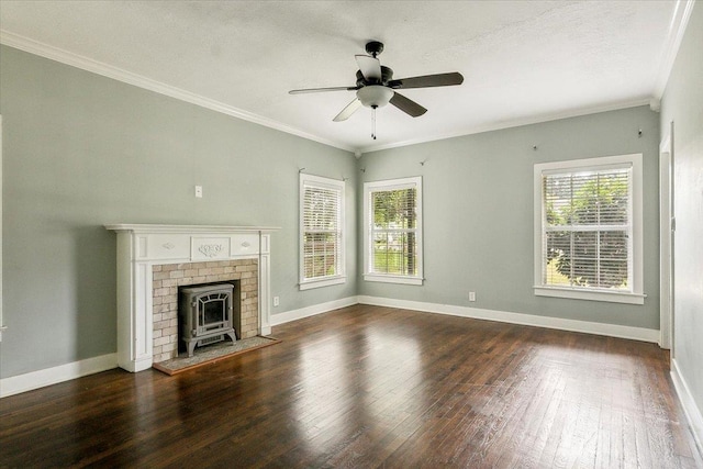 unfurnished living room featuring a wood stove, ceiling fan, ornamental molding, a textured ceiling, and dark hardwood / wood-style flooring