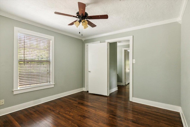 unfurnished bedroom with a textured ceiling, dark hardwood / wood-style floors, ceiling fan, and ornamental molding