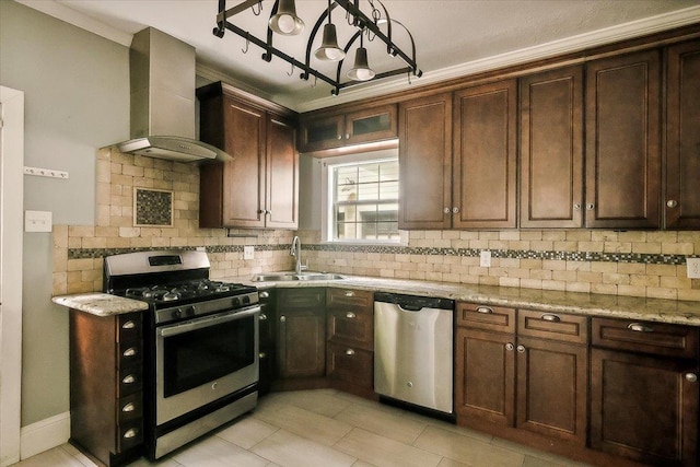 kitchen featuring sink, wall chimney exhaust hood, light stone countertops, tasteful backsplash, and stainless steel appliances