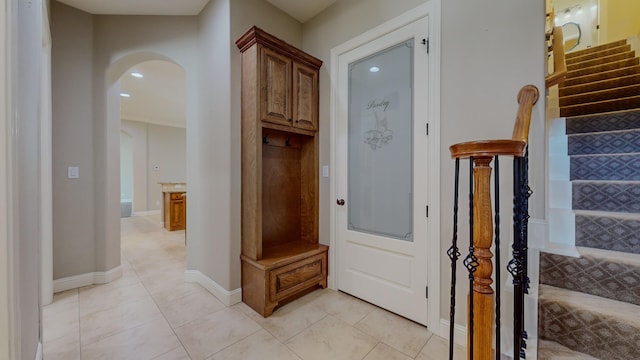 mudroom with light tile patterned floors