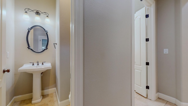 bathroom with tile patterned flooring and sink