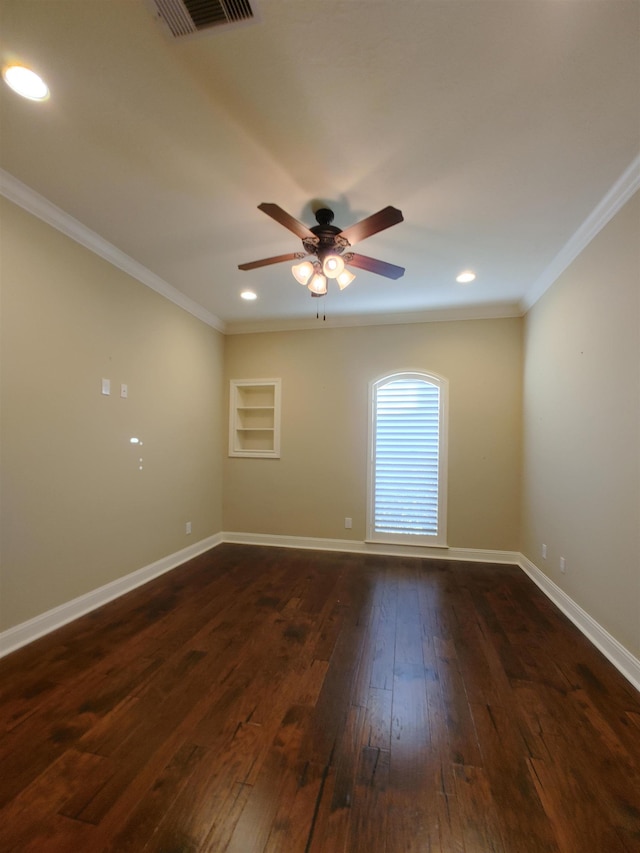 unfurnished room with crown molding, dark wood-type flooring, and ceiling fan