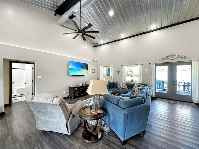 living room with dark wood-type flooring, a high ceiling, french doors, ceiling fan, and wood ceiling