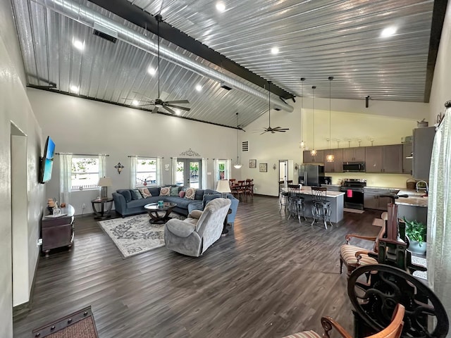 living room featuring ceiling fan, beamed ceiling, high vaulted ceiling, and dark hardwood / wood-style floors