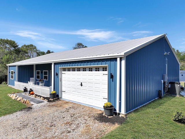 garage featuring central air condition unit and a porch