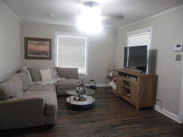 living area with dark wood-style flooring, crown molding, and baseboards