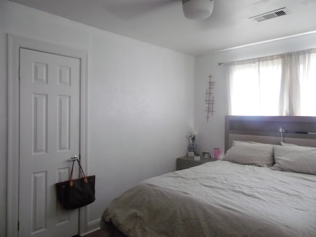 bedroom featuring visible vents and a ceiling fan