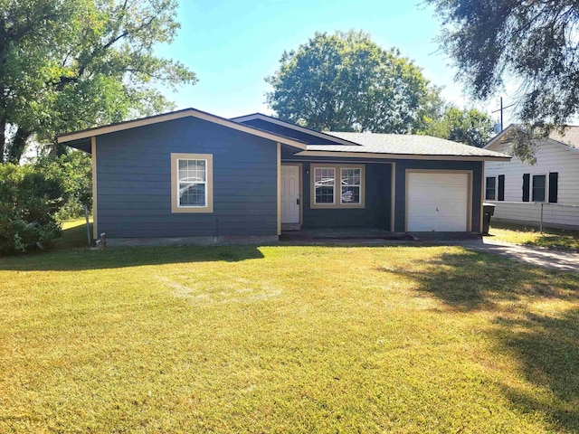 single story home featuring a front yard and a garage