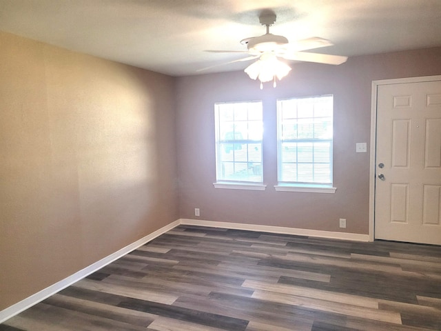interior space featuring ceiling fan and dark hardwood / wood-style flooring