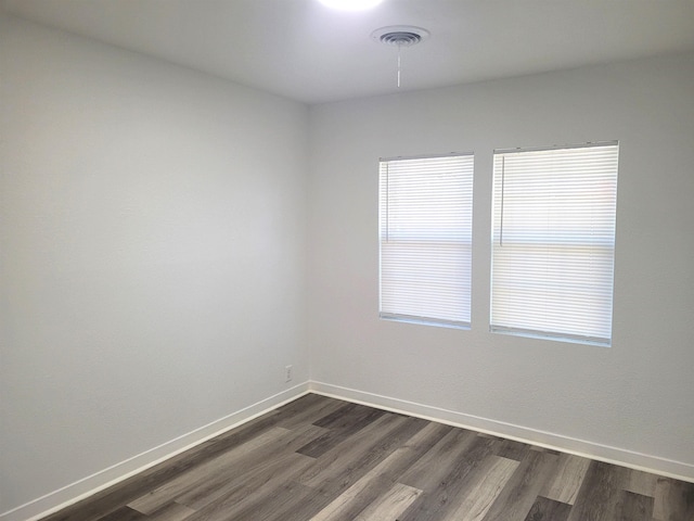 empty room featuring dark hardwood / wood-style floors