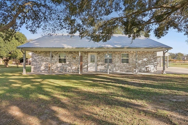 back of property featuring a yard and a patio area