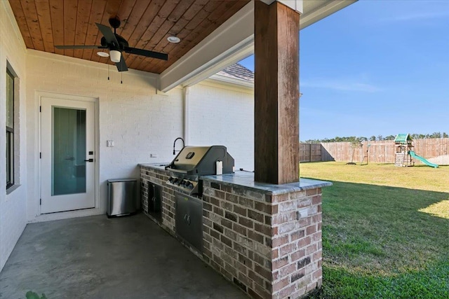 view of patio / terrace featuring a playground, area for grilling, and ceiling fan