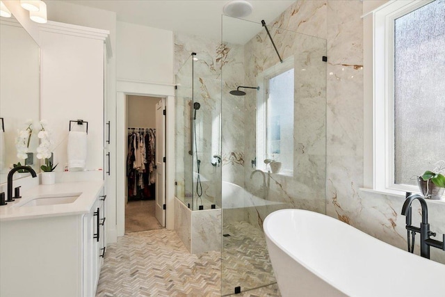 bathroom with vanity, independent shower and bath, and tile walls