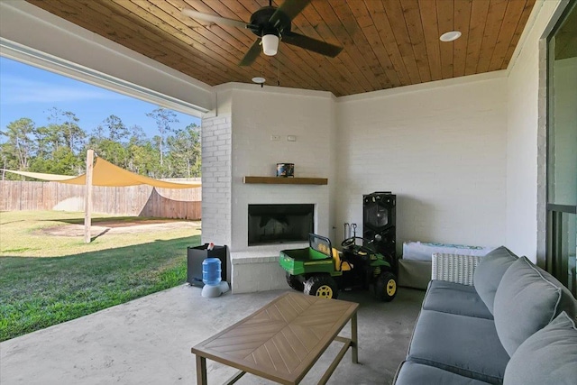 view of patio / terrace with ceiling fan and an outdoor brick fireplace