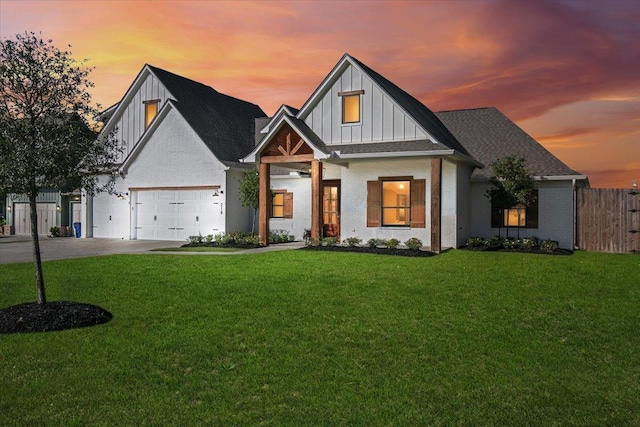 view of front facade featuring a lawn and a garage