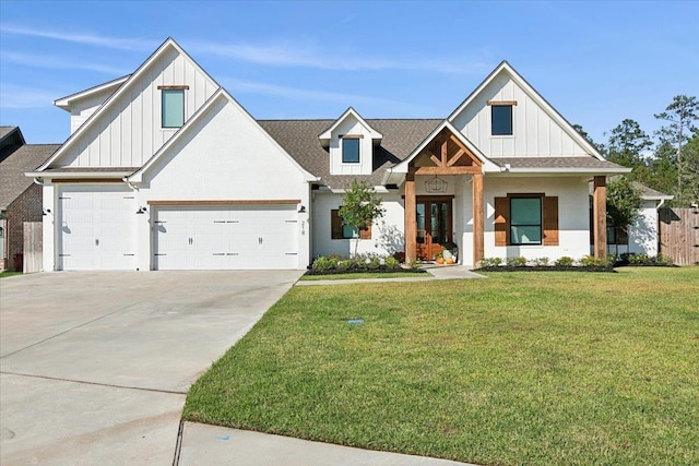 view of front facade with a garage and a front lawn