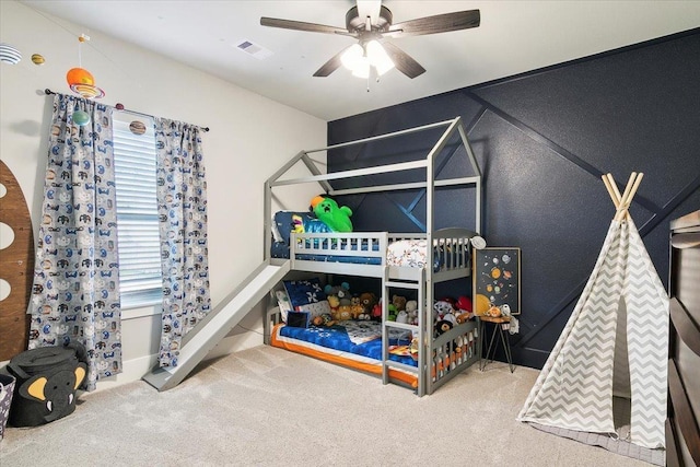 bedroom with ceiling fan and carpet floors