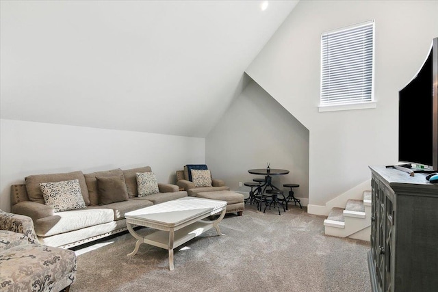 living room with carpet floors and lofted ceiling