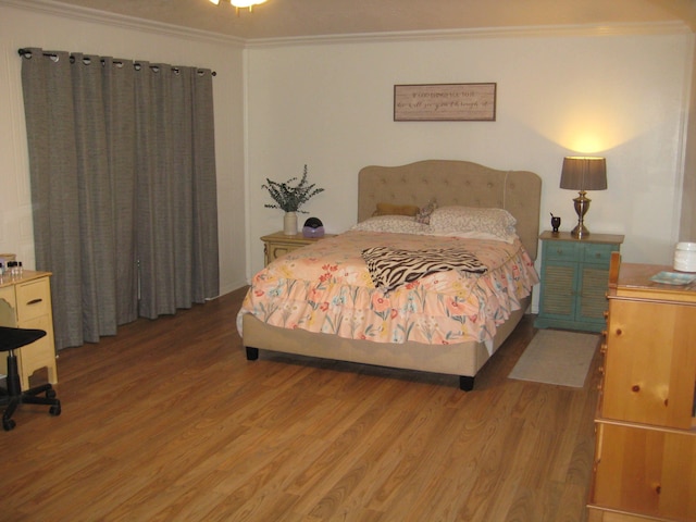 101 Locust Ln, Village Mills, TX 77663 - bedroom featuring light wood-type flooring and ornamental molding