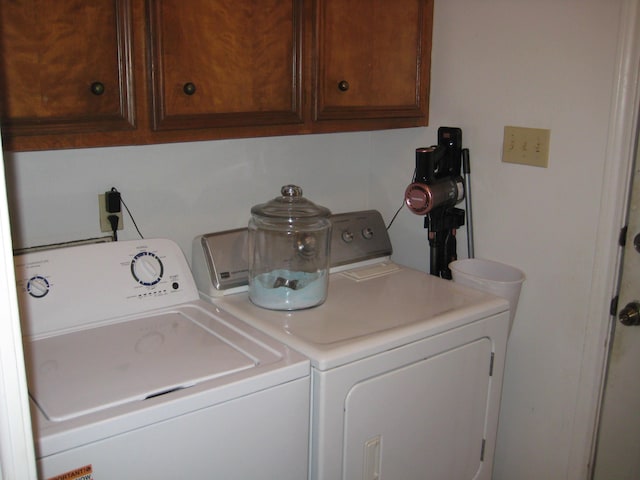 101 Locust Ln, Village Mills, TX 77663 - laundry room featuring washer and dryer and cabinet space
