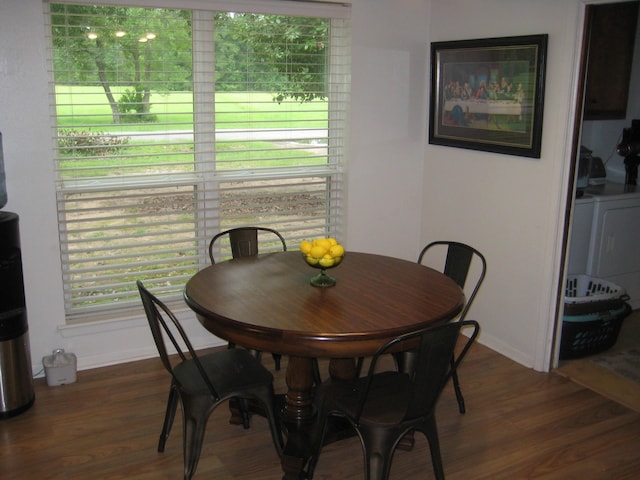 101 Locust Ln, Village Mills, TX 77663 - dining space featuring dark wood finished floors, washer / clothes dryer, and healthy amount of natural light