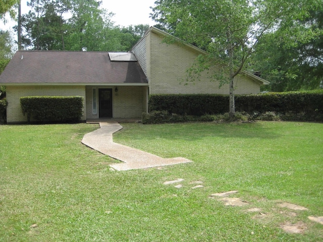 101 Locust Ln, Village Mills, TX 77663 - mid-century home featuring a front yard and brick siding