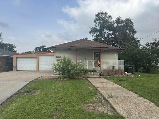 view of front of home featuring a porch, a garage, and a front lawn