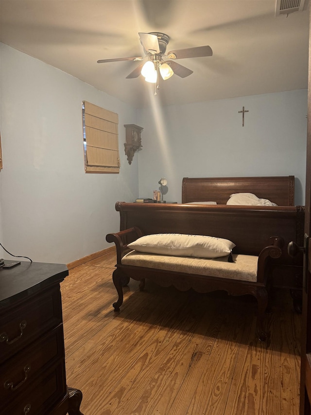 bedroom featuring light wood-type flooring and ceiling fan